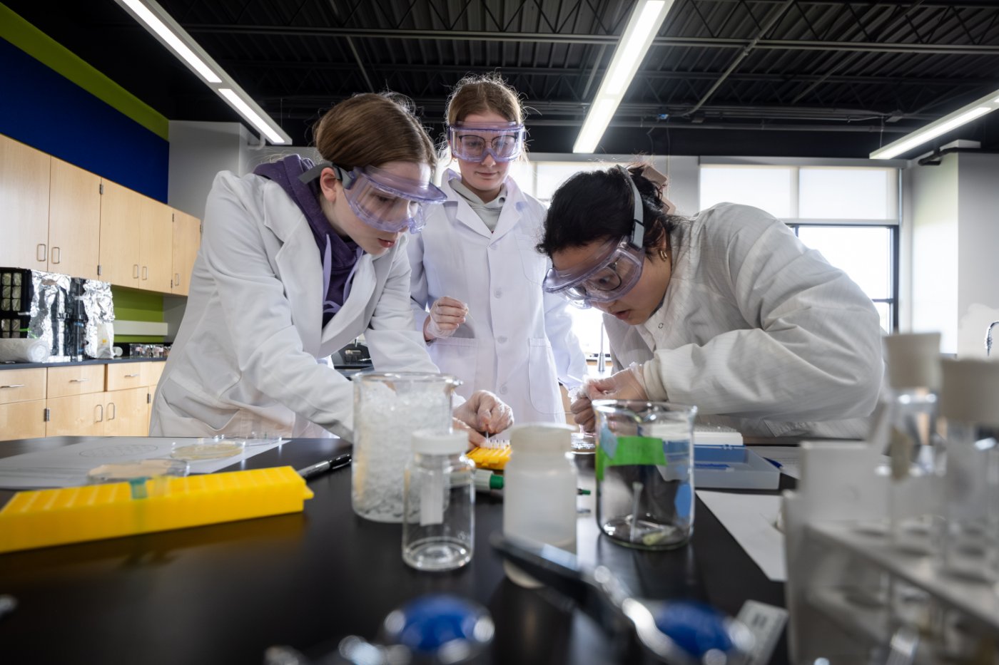 Three students doing a lab.