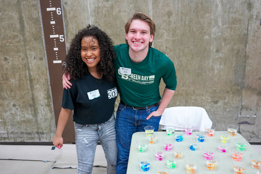 Two student employees working at event on campus