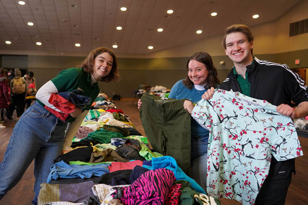 Students sort through donated clothing