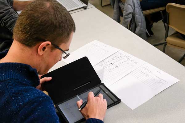 Student takes notes on tablet