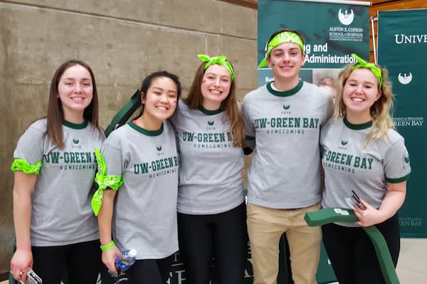Students pose for photo at homecoming event