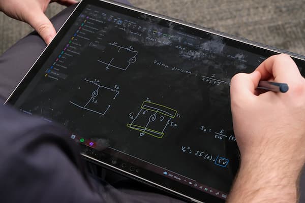 Electrical Engineering students use a Microsoft Surface tablet to take notes on circuits in Lecturer Taskia Khan’s Electrical Circuits I Lab