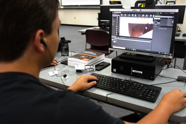 Student develops video game graphics in computer lab