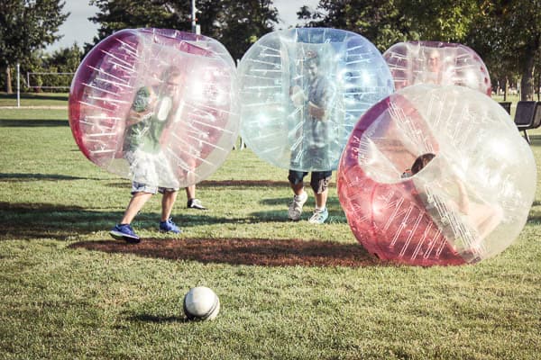 students playing human bubble ball