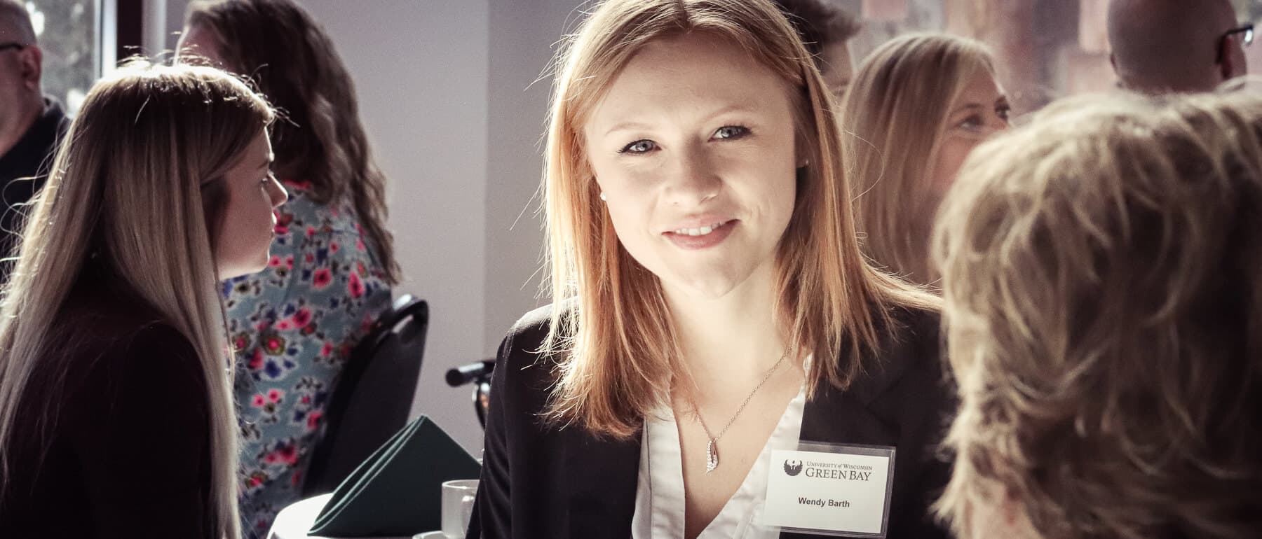 A UWGB business student at a networking luncheon