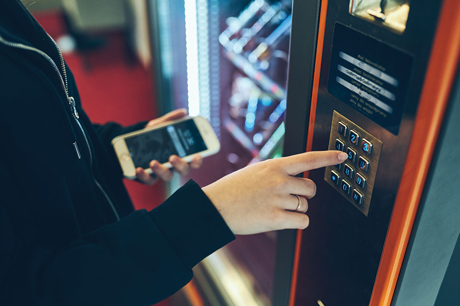 Student using a vending machine