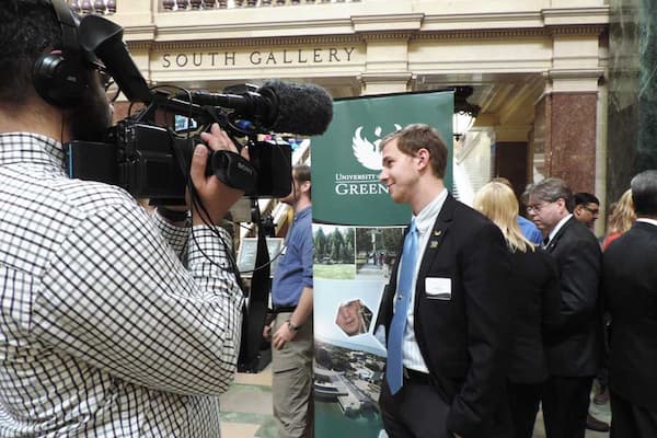 UW-Green Bay student being interviewed at research event