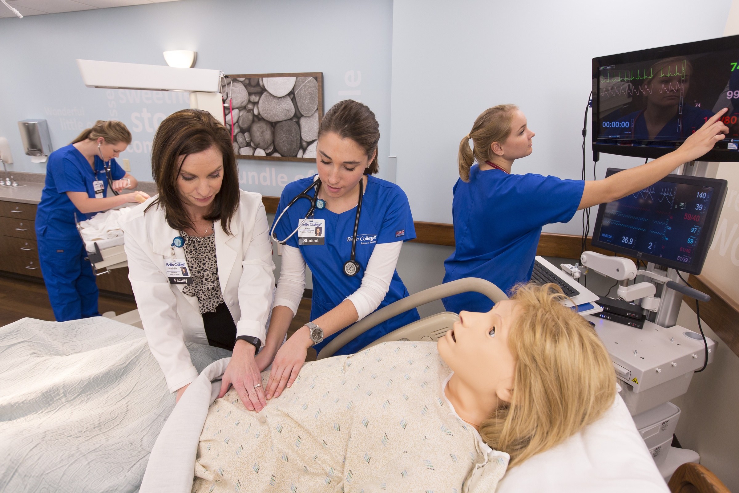 Medical students practicing on a dummy