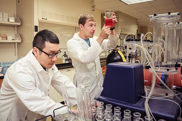 Two male students working in a UWGB Science lab