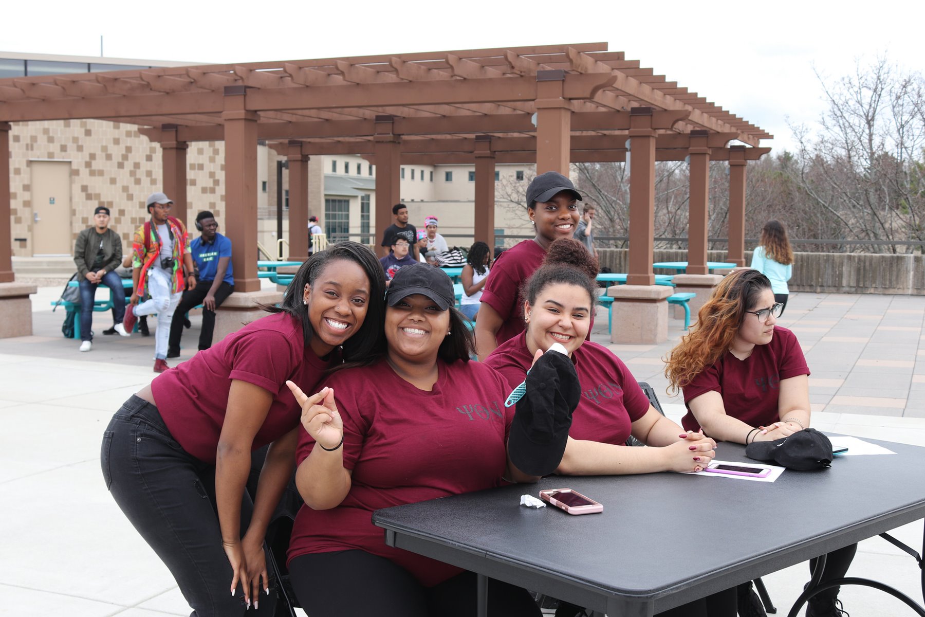 Five members of a student organization at a table