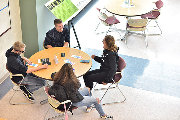 Students laughing at a table