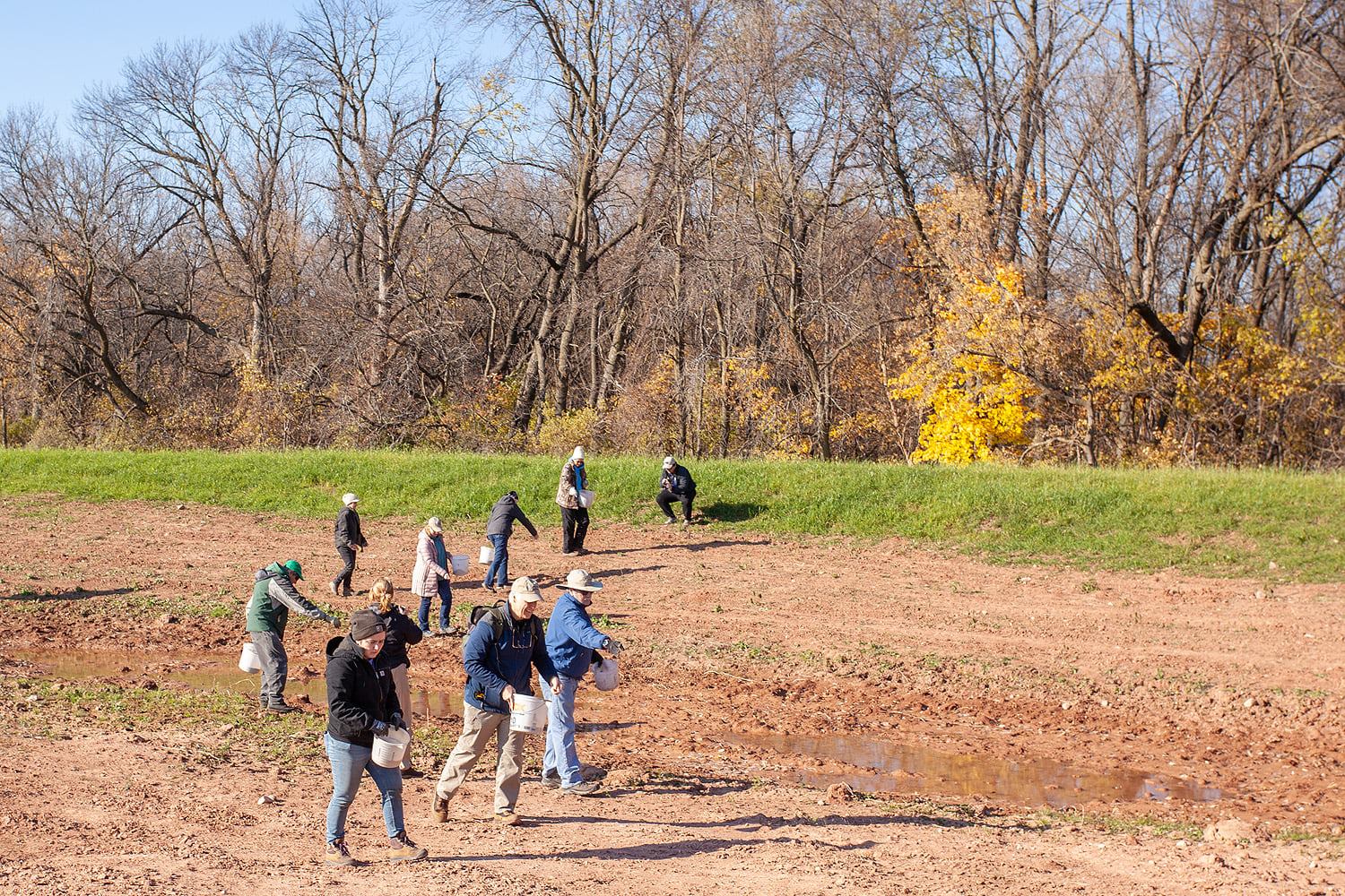 Group of students walking through a field