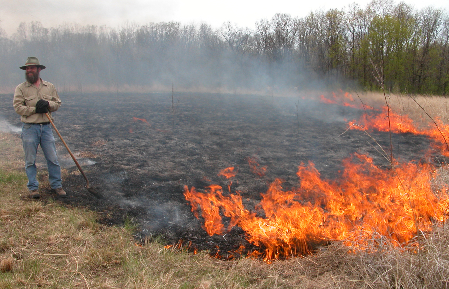 Gary Fewless monitoring a prairie burn