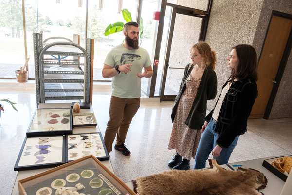 Two women learning about a Ritcher Museum display