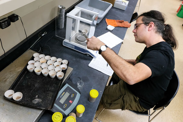 student doing soil research