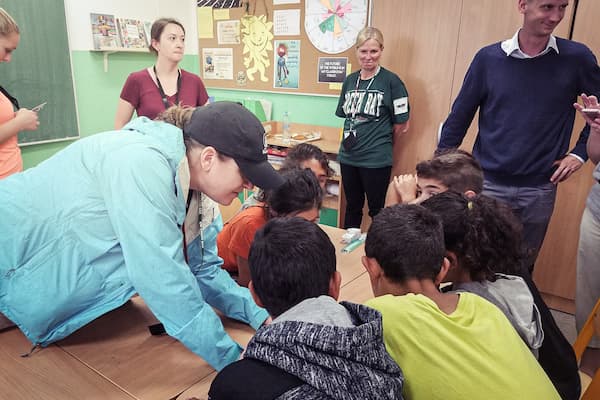 Community Health workers teaching children