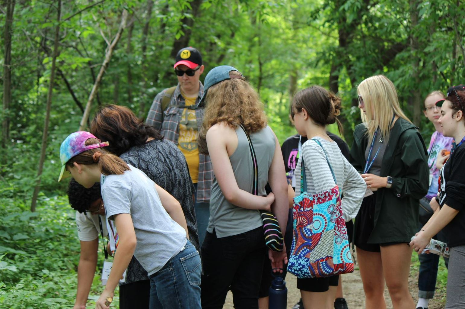 students playing a game and talking during Pride Camp