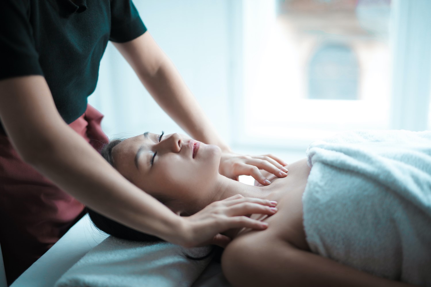 Image of massage therapist providing a service