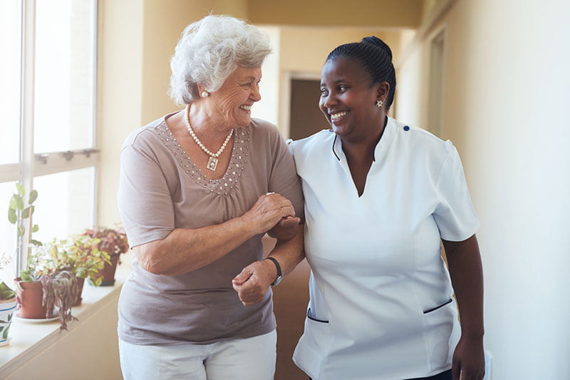 Caregiver walking with patient