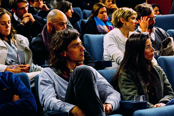 Group of people listening to a presentation