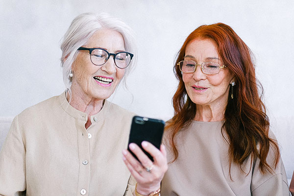 Mature women looking at phone