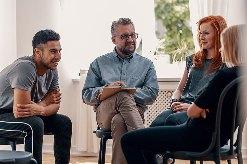 Social worker with clients