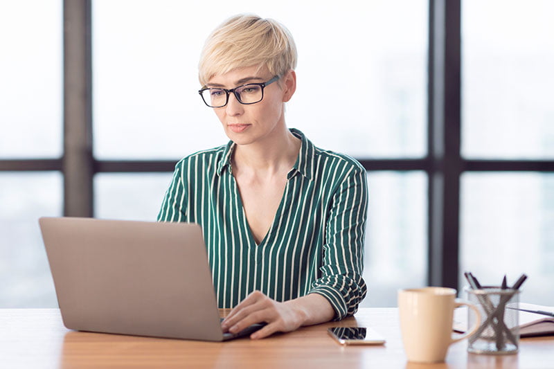 women leader working on laptop