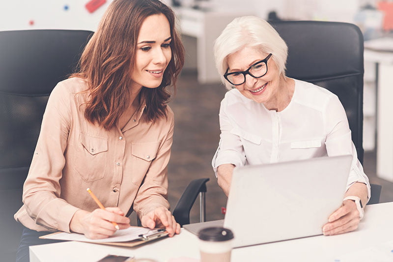 woman working with elderly person