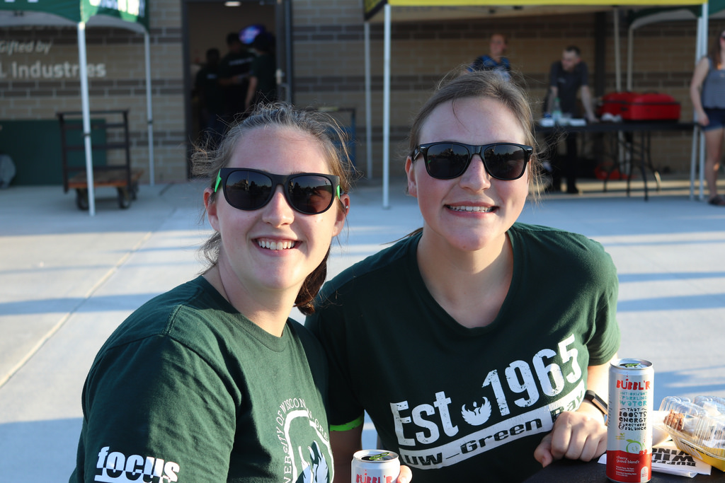 Two students smiling outside