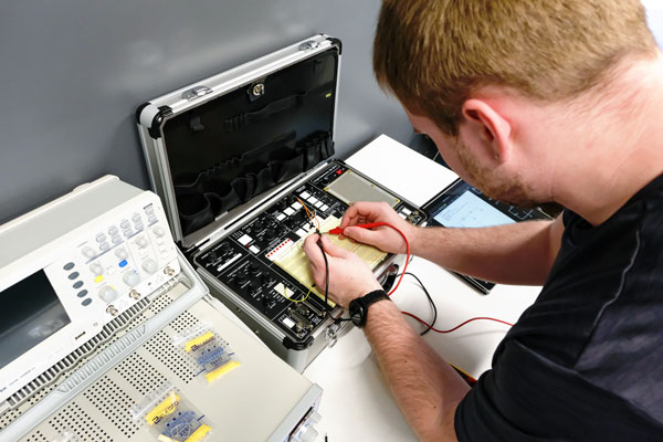 Student works on circuit board