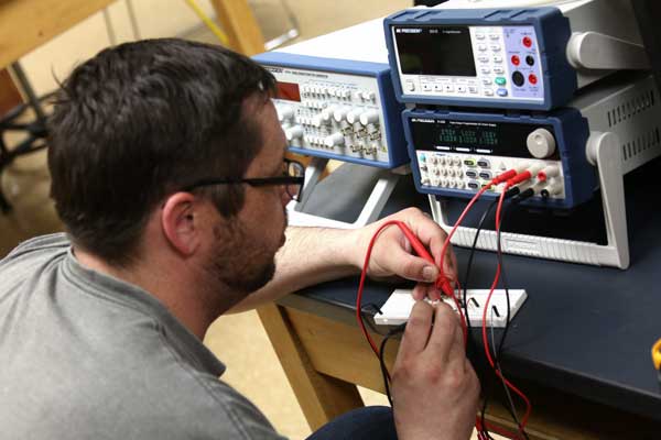 Male student works on circuit
