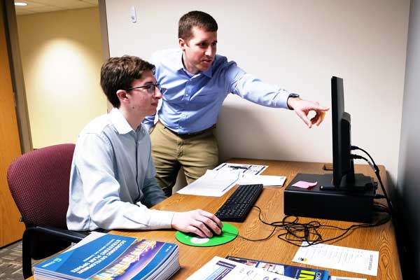 Business students work at computer
