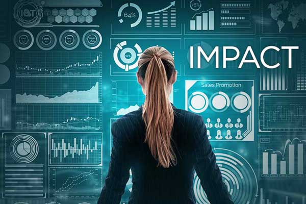 Female stands in front of Impact sign