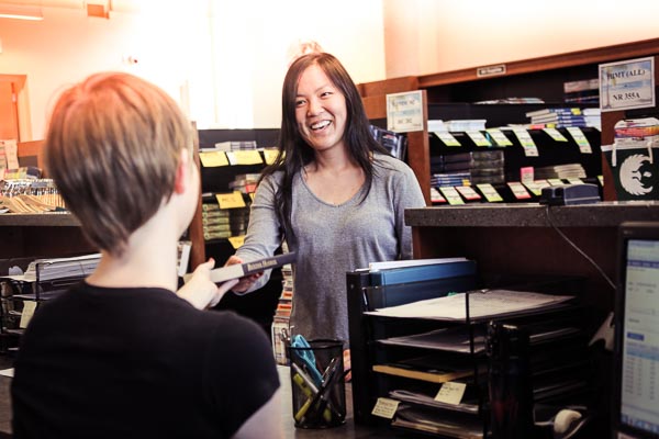 student employee working at the bookstore