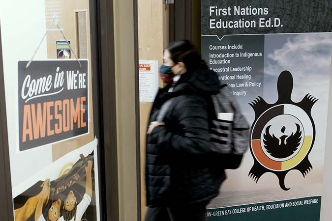 Student entering the First Nations Education Ed.D. office video still frame