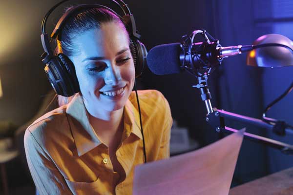 Student reads over script in studio