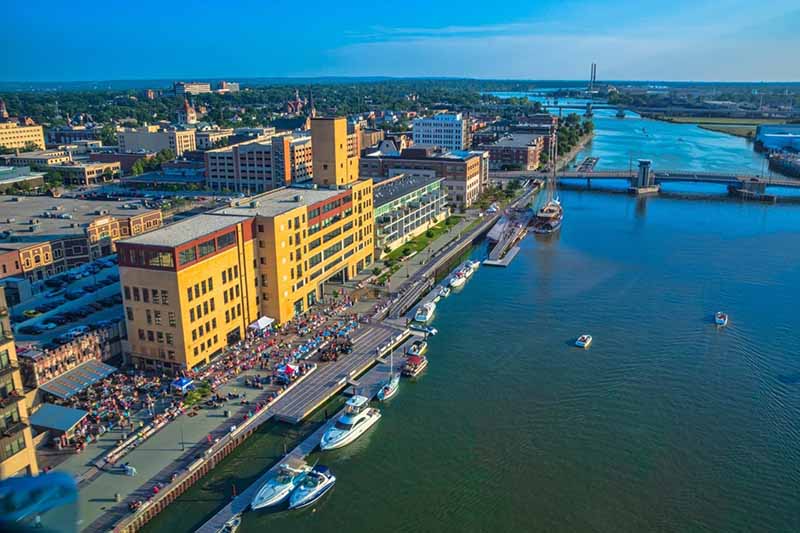 drone view of City Deck in Downtown Green Bay along the Fox River