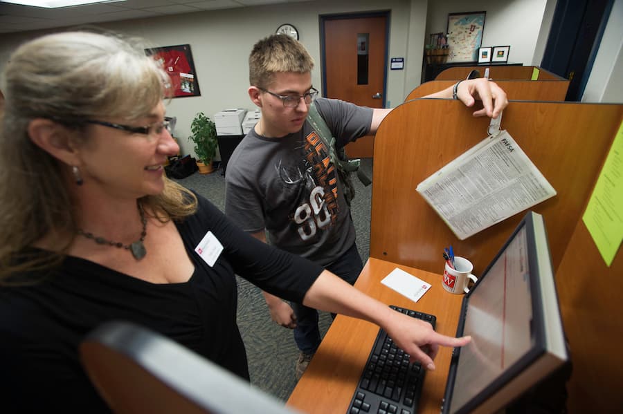 Pam Olson helping a student at the Marinette Campus