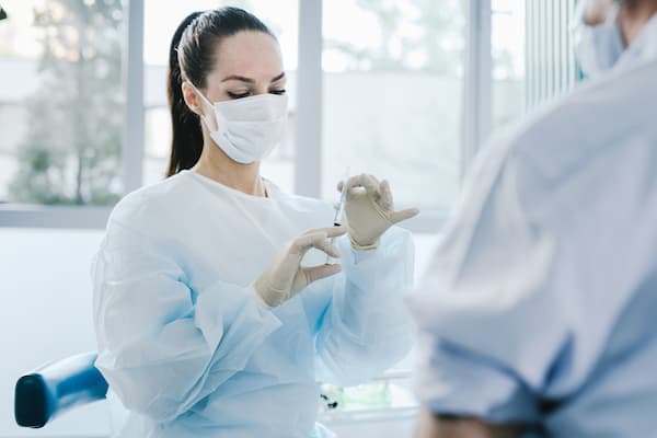 Doctor prepares vaccine shot