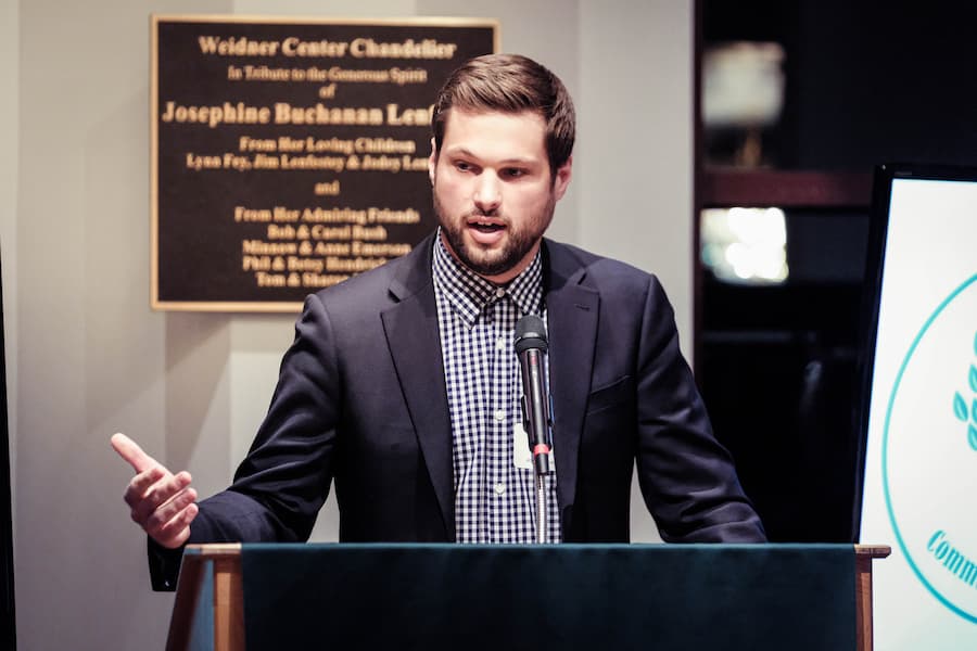 Male Human Resources student gives speech at business event