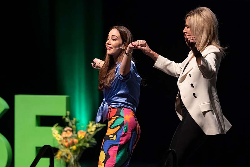 Mariana Atencio and Laurie Butz dancing as Mariana is introduced
