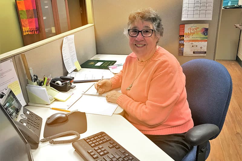 Volunteer working at front desk