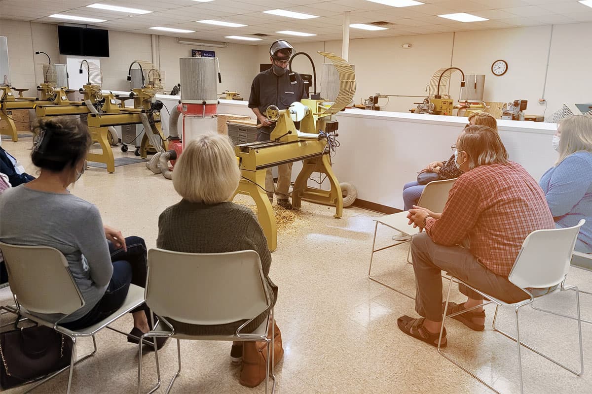 Members in a woodworking class