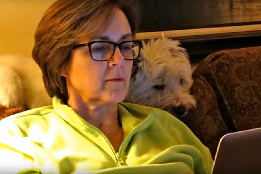 Nurse administrator works from home with dog