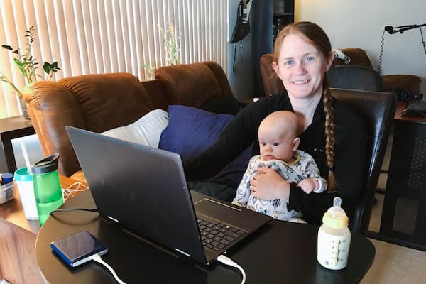 Student works from home with baby