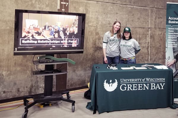 Kay and Kathleen pose for photo at a business week