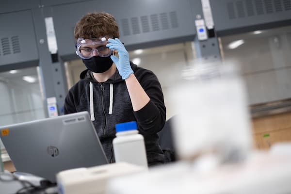 male student in lab