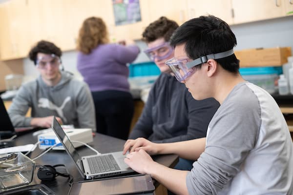 male student in lab