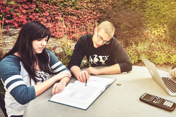 Two students study outside