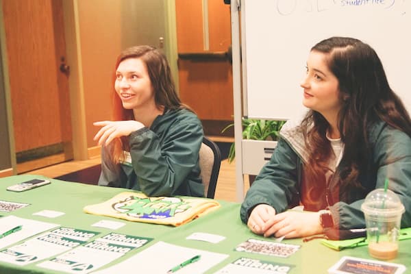 Female students promote Student Life club at Org Smorg